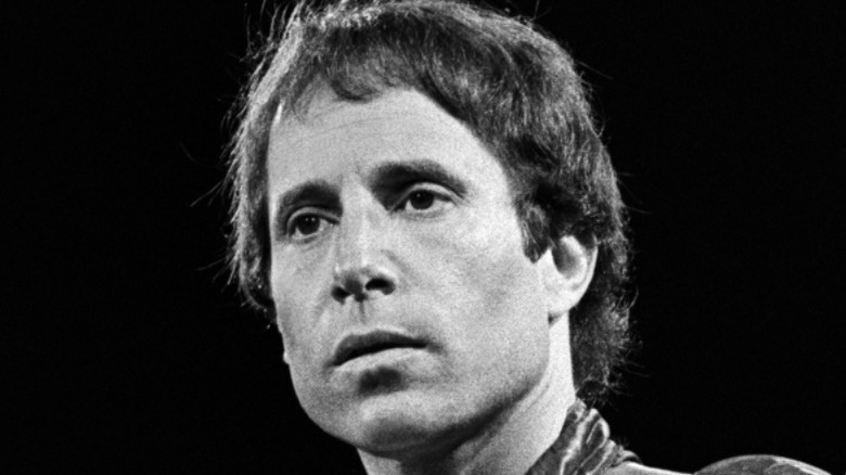 Paul Simon staring ahead