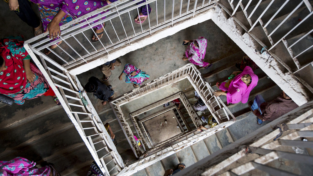 view from the top of people walking up and down stairs