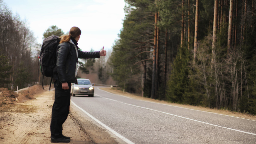 Person hitchhiking