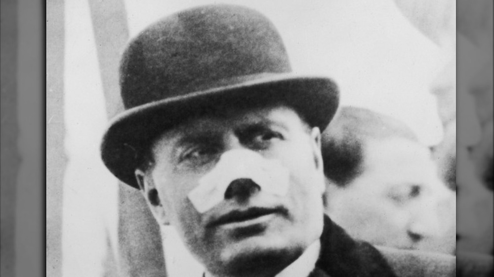 Mussolini with bandaged nose
