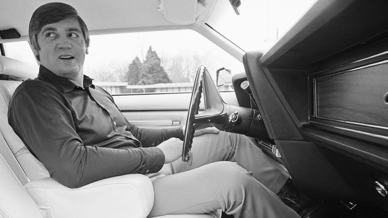 Buford Pusser sitting in a car 