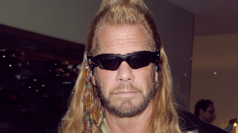 duane dog chapman long hair sunglasses looking serious