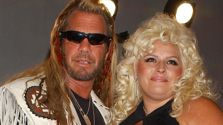 duane dog chapman wincing with beth chapman smiling