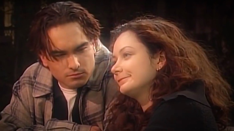 Sara Gilbert and Johnny Galecki in a scene from Roseanne