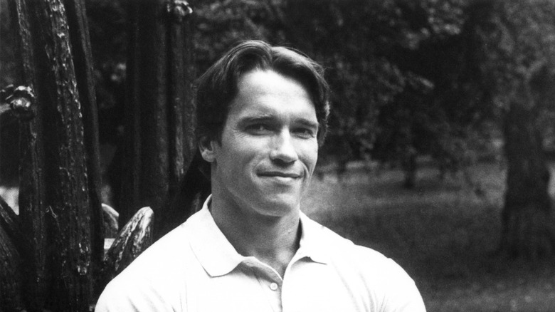 Young Arnold Schwarzenegger posing shirtless
