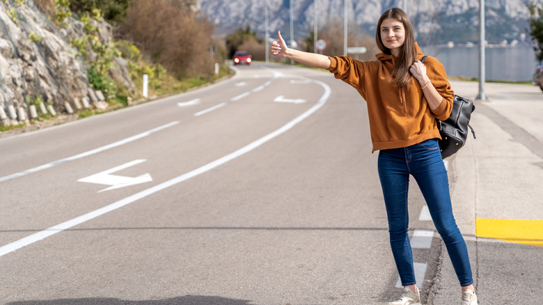 Woman hitchhiking