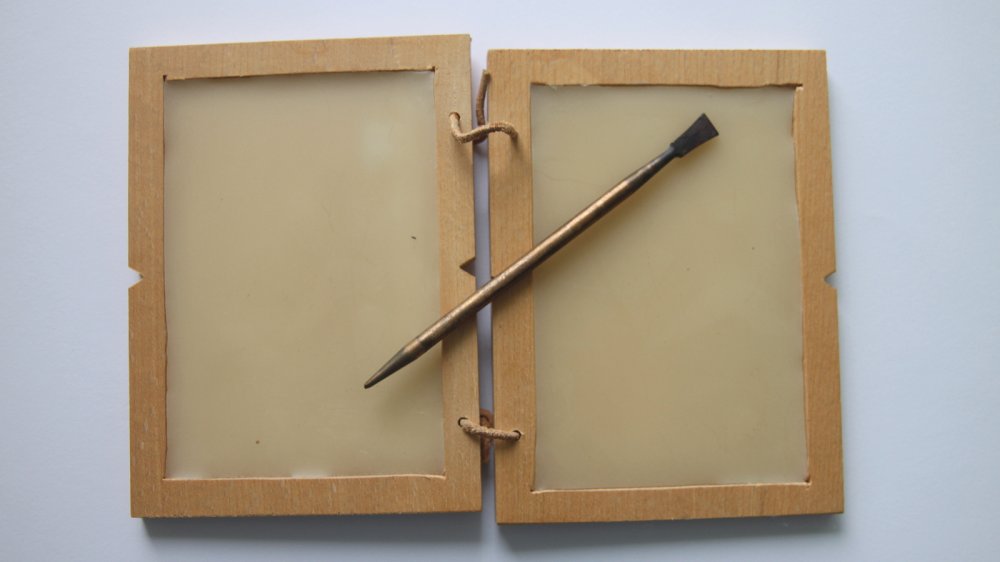 A stylus and wooden tablet in the ancient Roman style