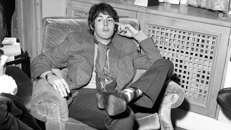 Paul McCartney sitting