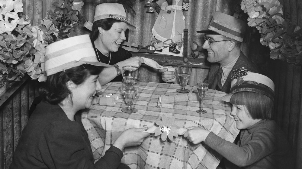 Family pulling Christmas crackers