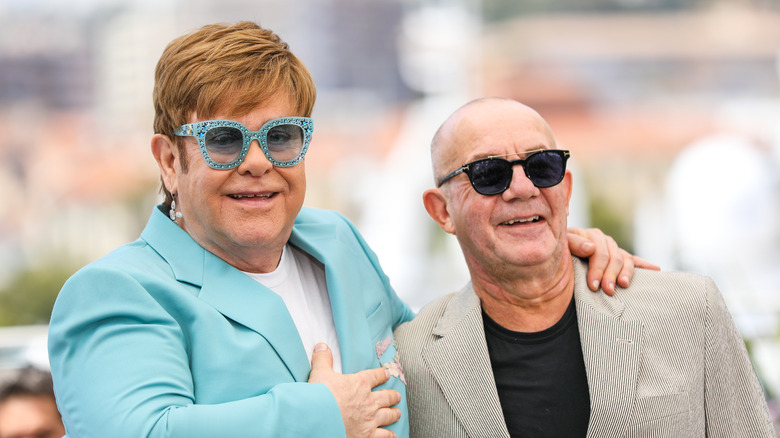 Elton John and Bernie Taupin smiling together