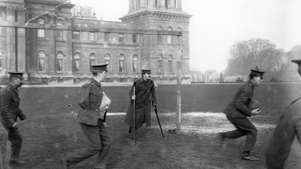 Wounded British soldiers playing soccer.