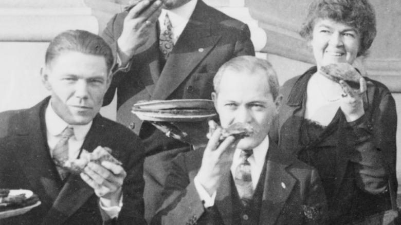 Members of Congress posed, eating pie