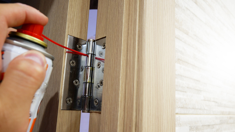 oiling a door hinge