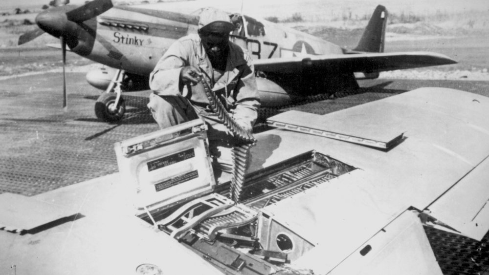 Tuskegee Airman reloading P-51