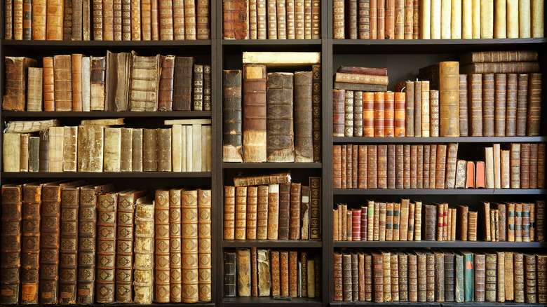 Old books on wooden shelves