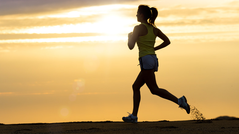 Woman jogging at dusk