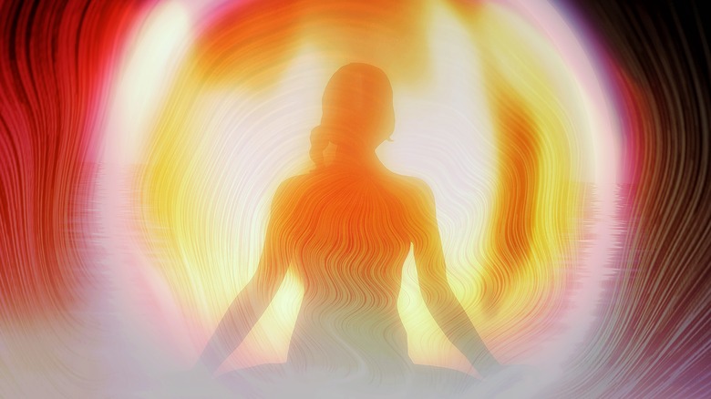 Woman enshrouded in aura