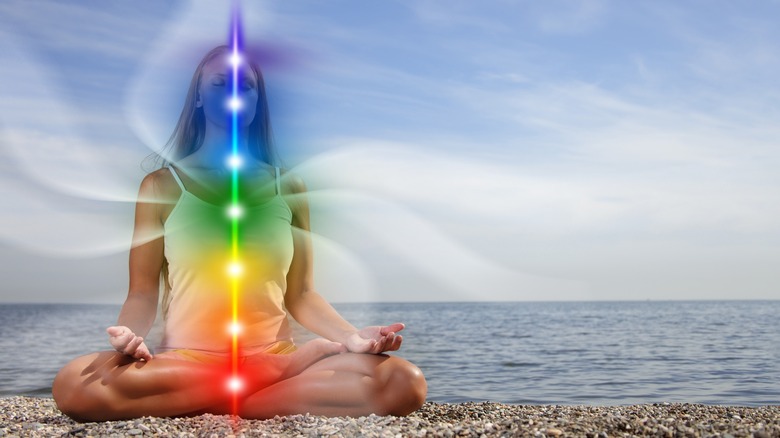 Chakras visible in meditating woman