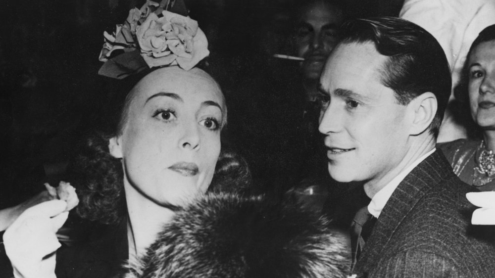 Joan Crawford and Franchot Tone at a party