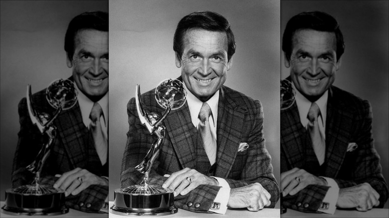 Bob Barker posing with Golden Globe award