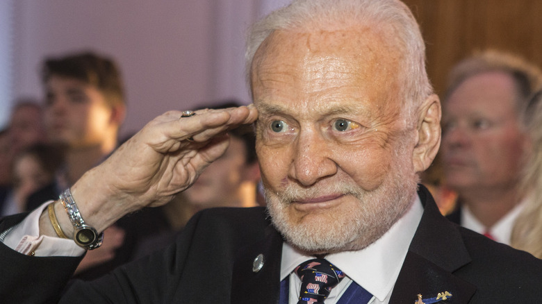 buzz aldrin salutes at party