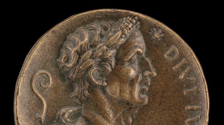 a Roman coin with the face of Caesar