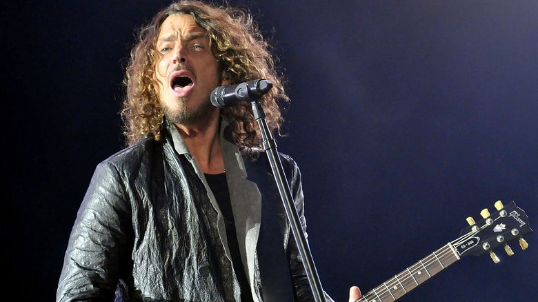 Chris Cornell mouth open microphone guitar