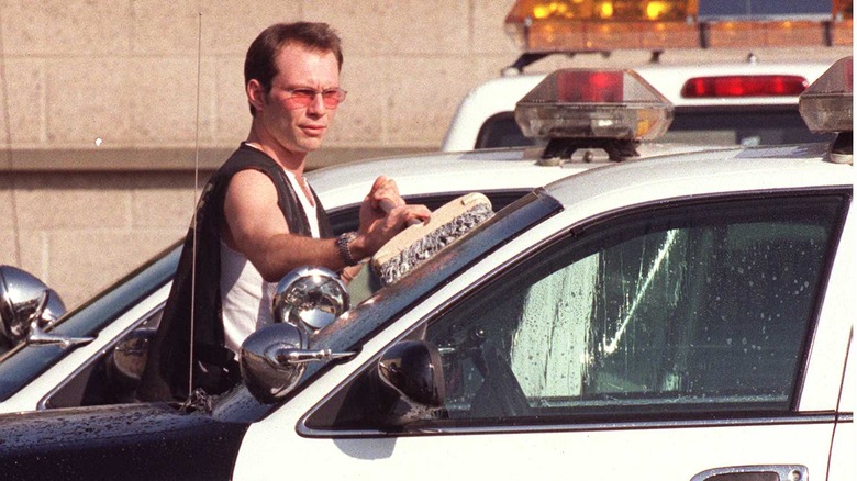 Christian Slater cleaning car