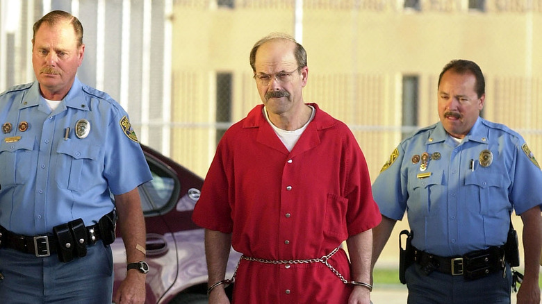 Dennis Rader escorted by policemen