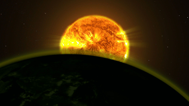 Starlight shining through an exoplanet atmosphere.