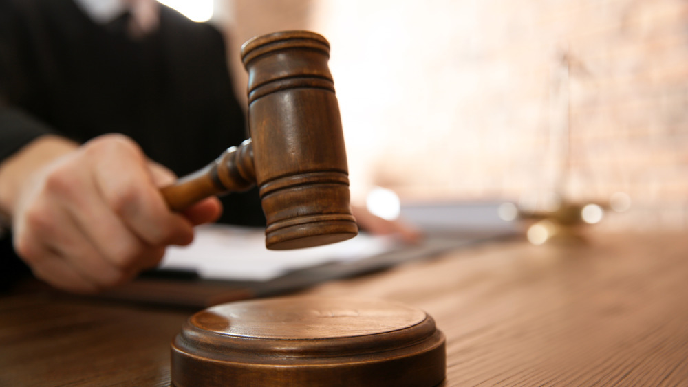 Judge using gavel in courtroom