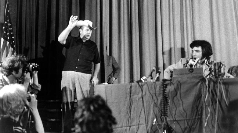 Colonel Tom Parker and Elvis Presley in a press conference