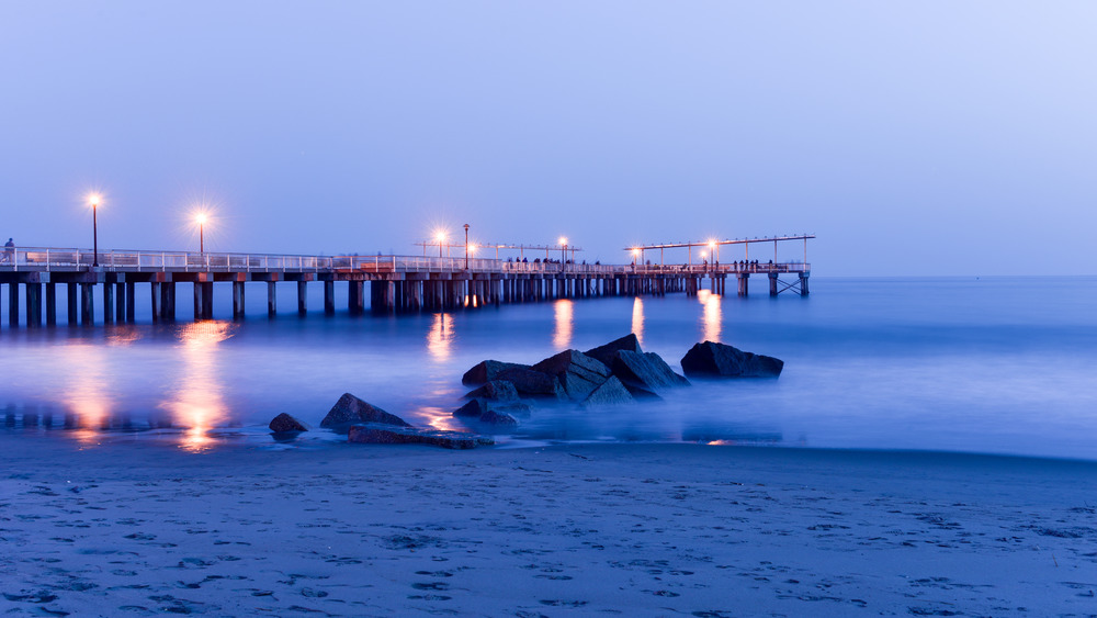 Coney Island beach and pier at night