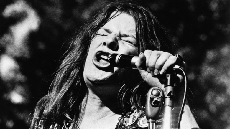 Janis Joplin singing outdoors