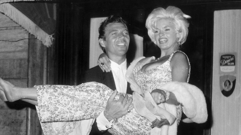 Mickey Hargitay carrying Jayne Mansfield