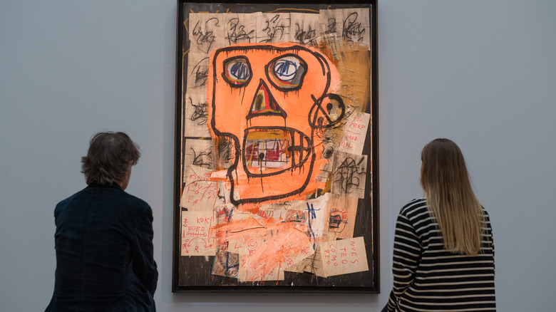 Viewers looking at Basquiat's 'Untitled'