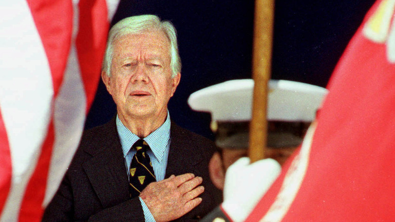 Jimmy Carter salutes the flag