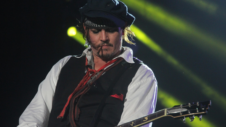 Johnny Depp playing guitar