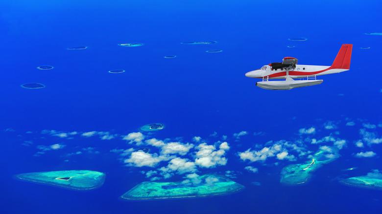 Seaplane flies over Maldives atoll
