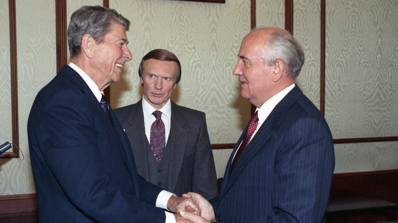 Ronald Reagan and Mikhail Gorbachev holding hands