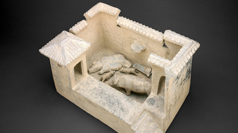 Clay model of pig latrine
