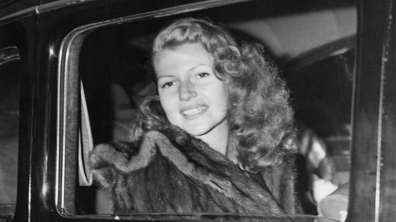 Rita Hayworth in car