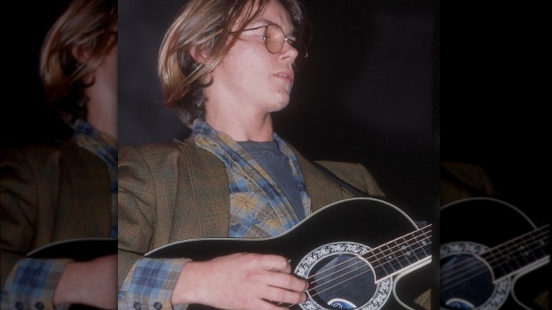 River Phoenix playing guitar