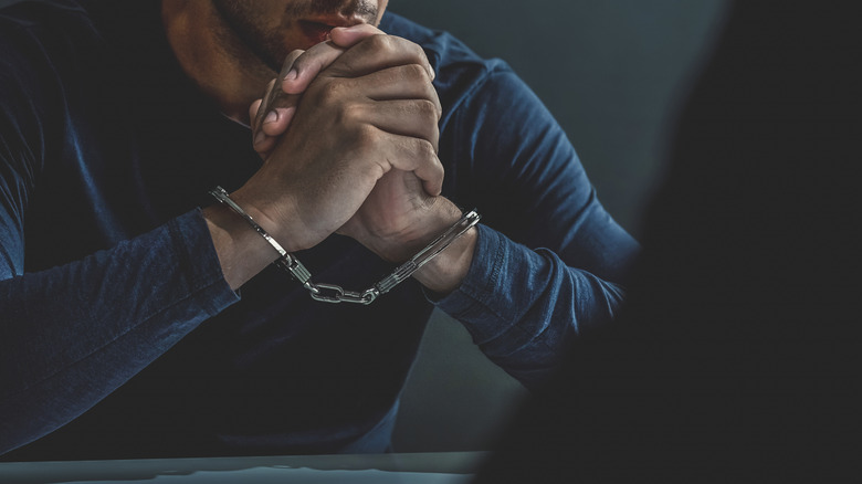 man wearing handcuffs