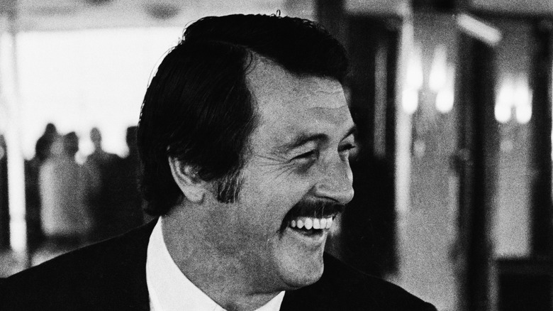 Rock Hudson laughing with moustache