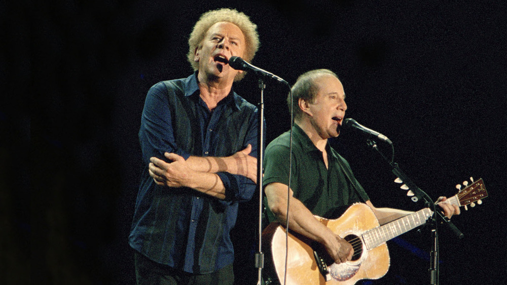 Musicians Art Garfunkel and Paul Simon perform