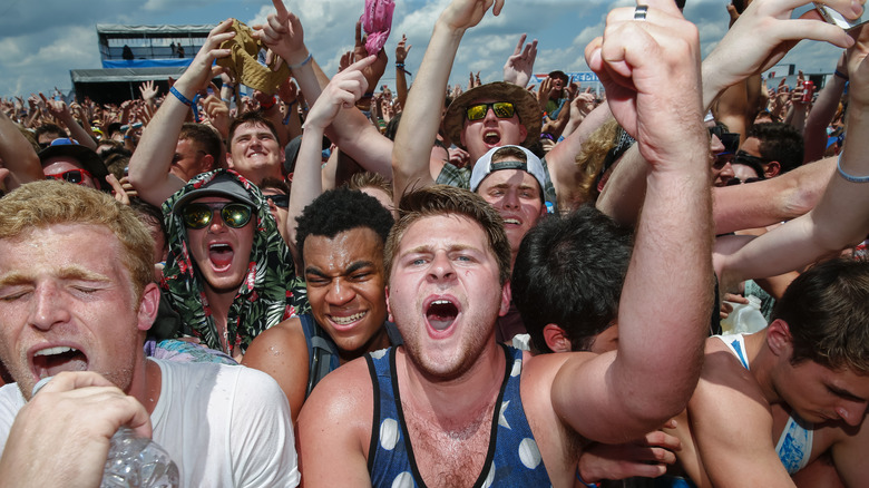 people cheering at the snake pit