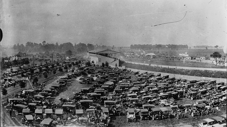 black and white photo of cars at the indy 500