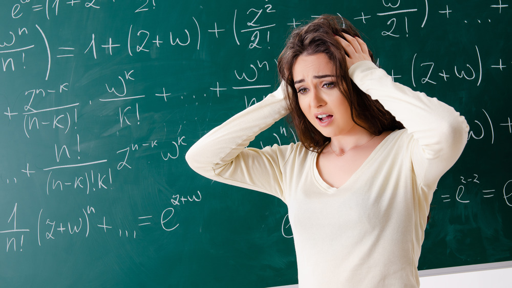 Confused woman and chalkboard 