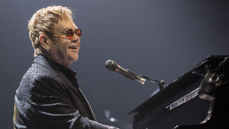 elton john playing piano